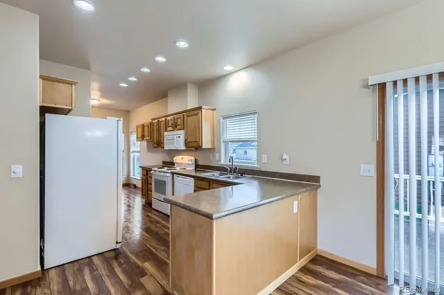 a kitchen that has a sink cabinets counter space and stainless steel appliances
