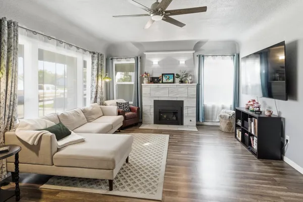 a living room with furniture and a fireplace