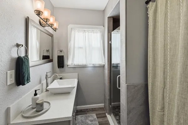 a bathroom with a sink and a mirror