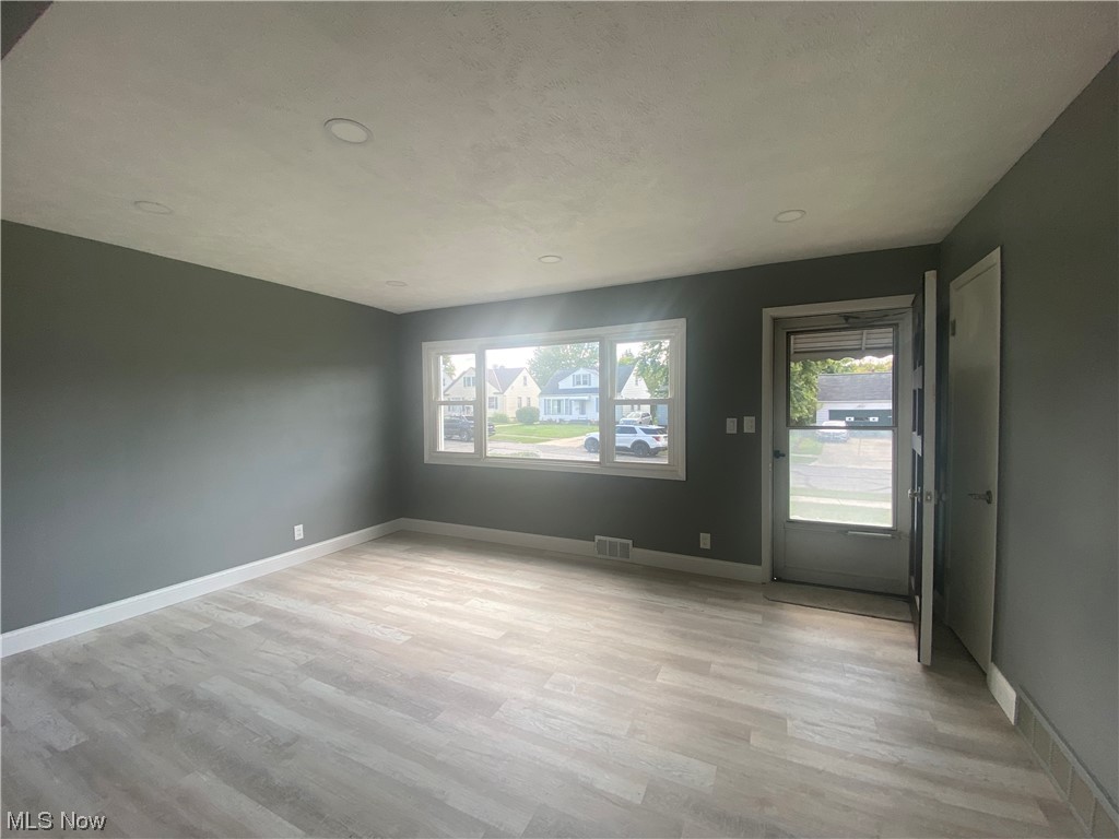12913 Silver Road Cleveland, OH 44125 - Photo 8 of 23 Living room with recessed lighting and plenty of natural light