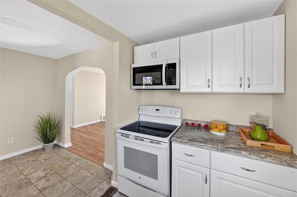 314 Fort Couch Road Pittsburgh, PA 15241 - Photo 11 of 26 a kitchen with granite countertop white cabinets and white appliances