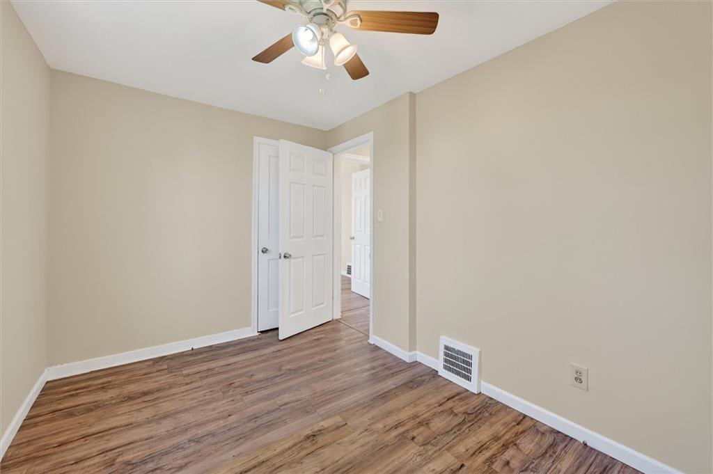 314 Fort Couch Road Pittsburgh, PA 15241 - Photo 14 of 26 a view of an empty room with wooden floor