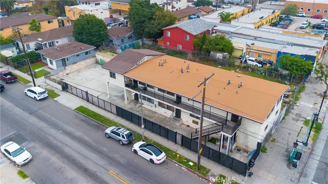 an aerial view of a house with outdoor space