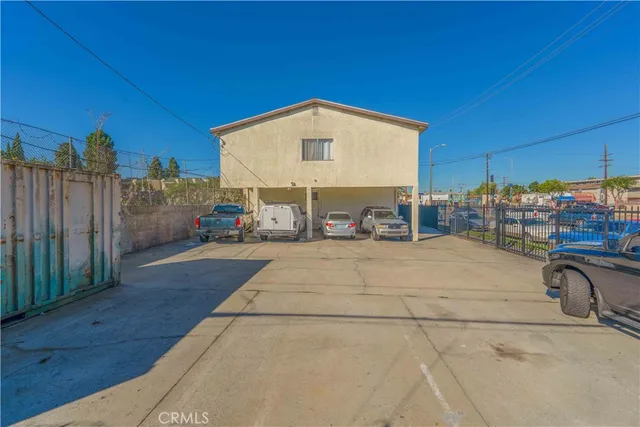 a view of a street with tables and chairs