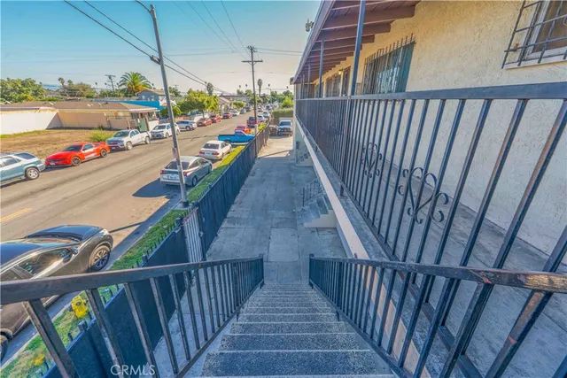 a view of a balcony with staircase