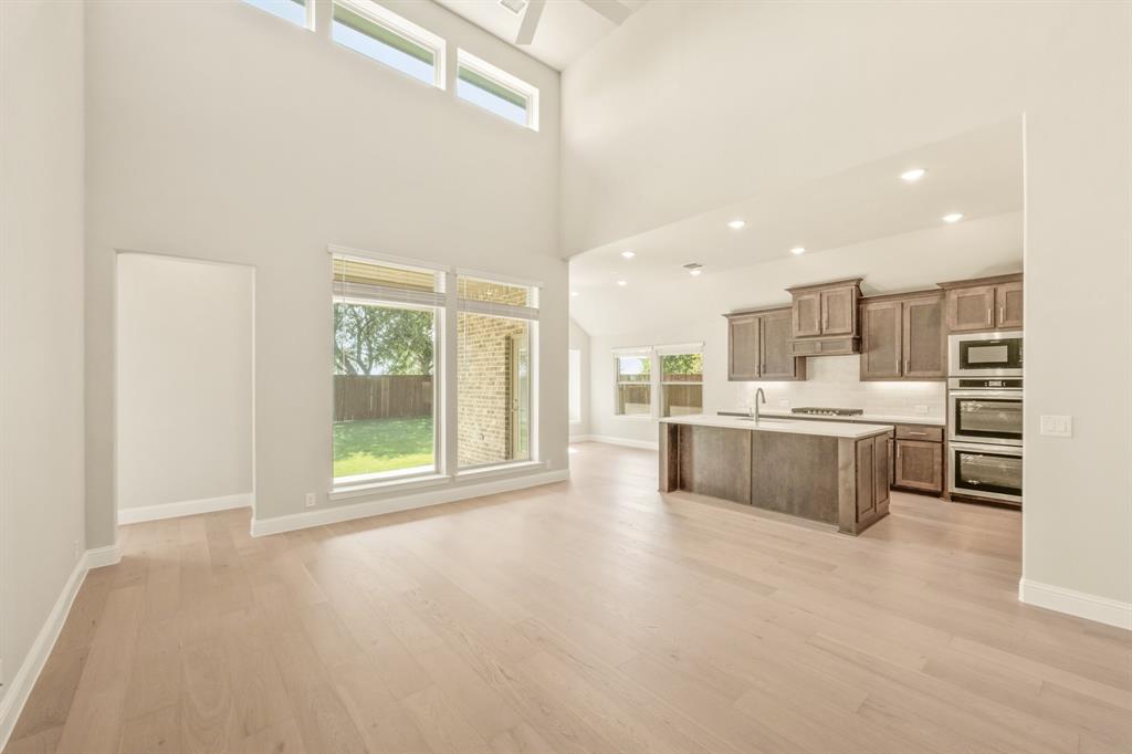 1098 Foxtail Drive Justin, TX 76247 - Photo 13 of 40 a large white kitchen with a large window