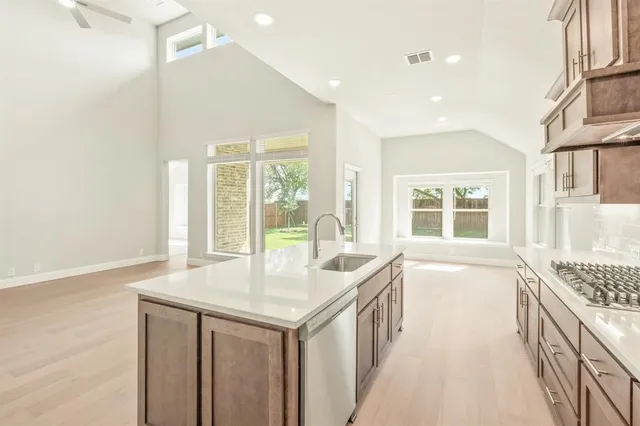 a spacious bathroom with a granite countertop sink and a large mirror