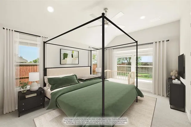 a living room with large windows and a flat screen tv