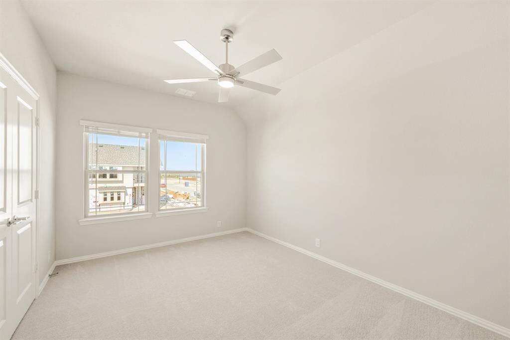 1098 Foxtail Drive Justin, TX 76247 - Photo 33 of 40 an empty room with a window and a fan