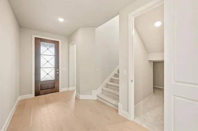 a view of entryway with wooden floor