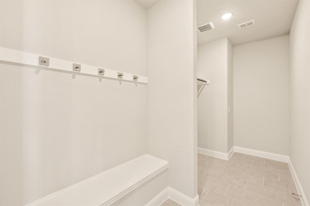 1098 Foxtail Drive Justin, TX 76247 - Photo 9 of 40 a bathroom with a shower and toilet