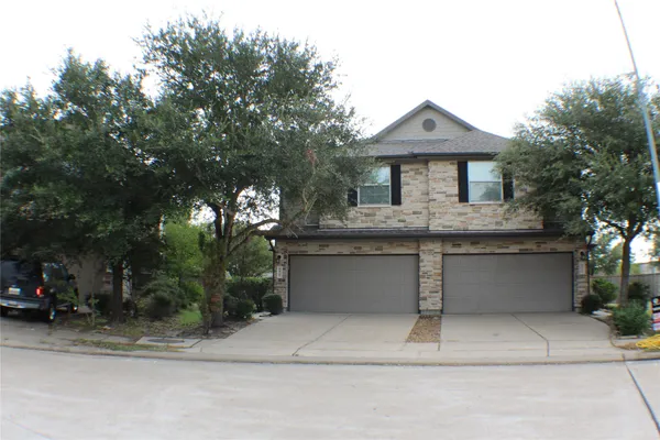 a front view of a house with a garage