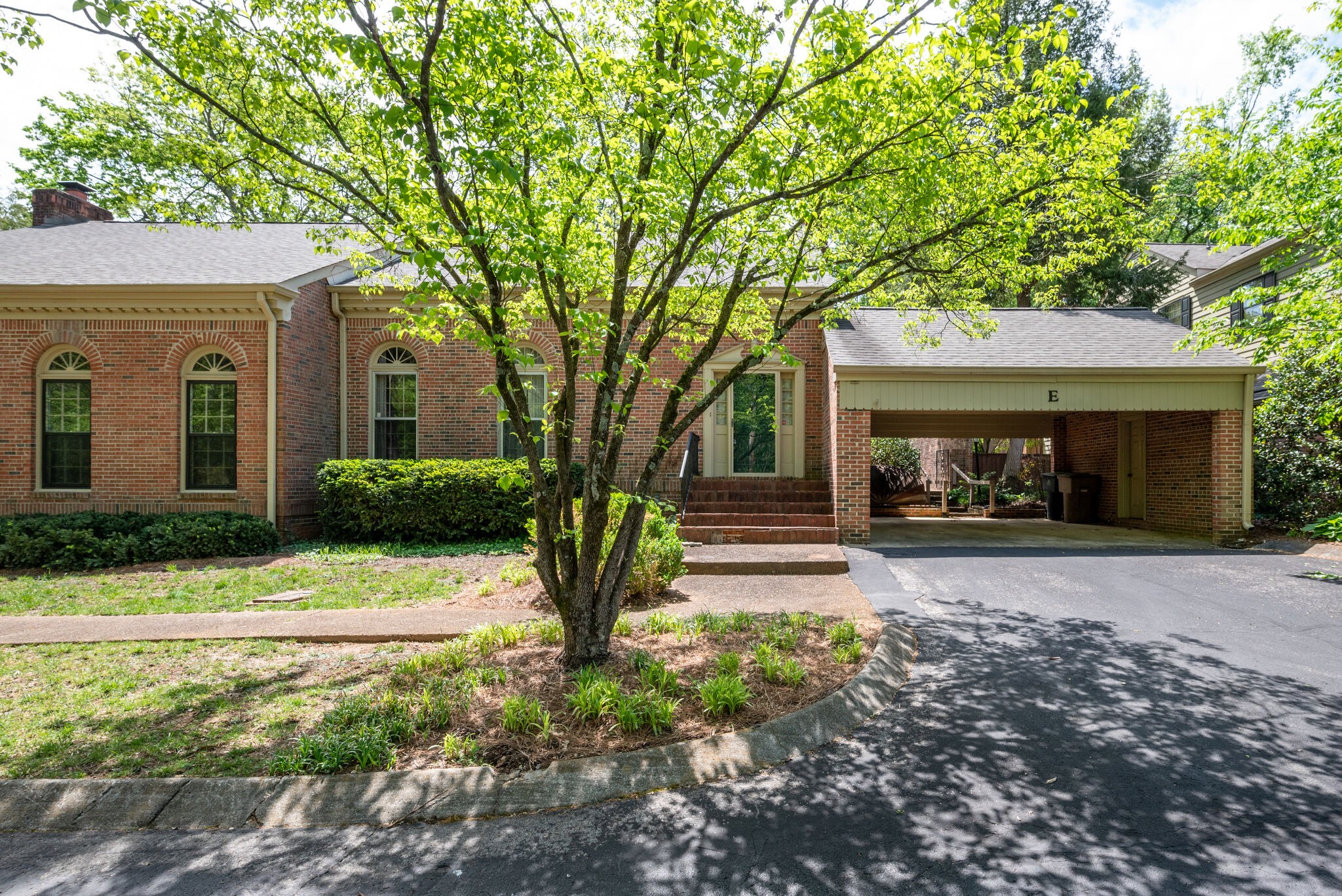 3704 Estes Road, Unit E Nashville, TN 37215 - Photo 1 of 27 a front view of a house with garden