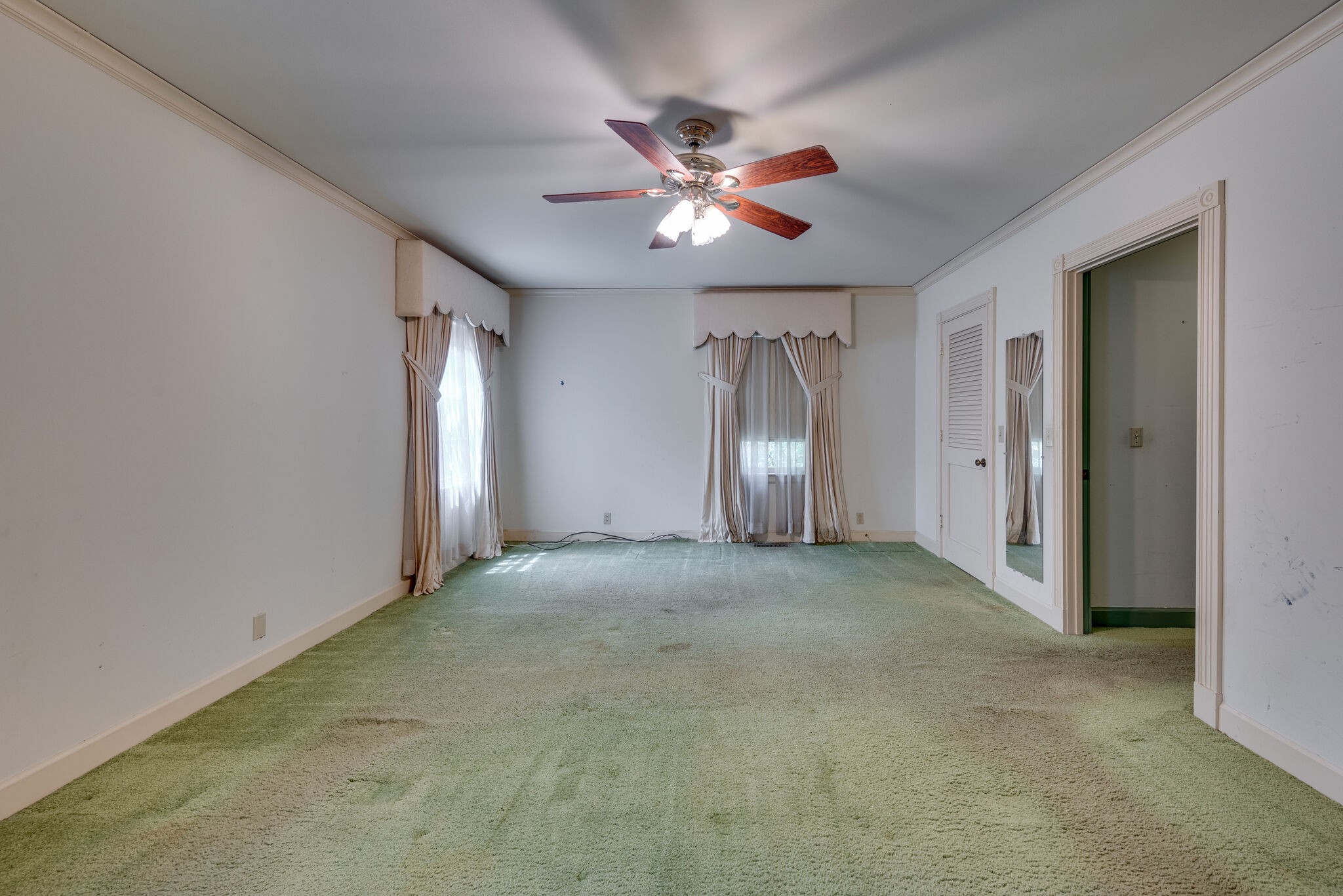 3704 Estes Road, Unit E Nashville, TN 37215 - Photo 17 of 27 a view of a livingroom with a ceiling fan and window