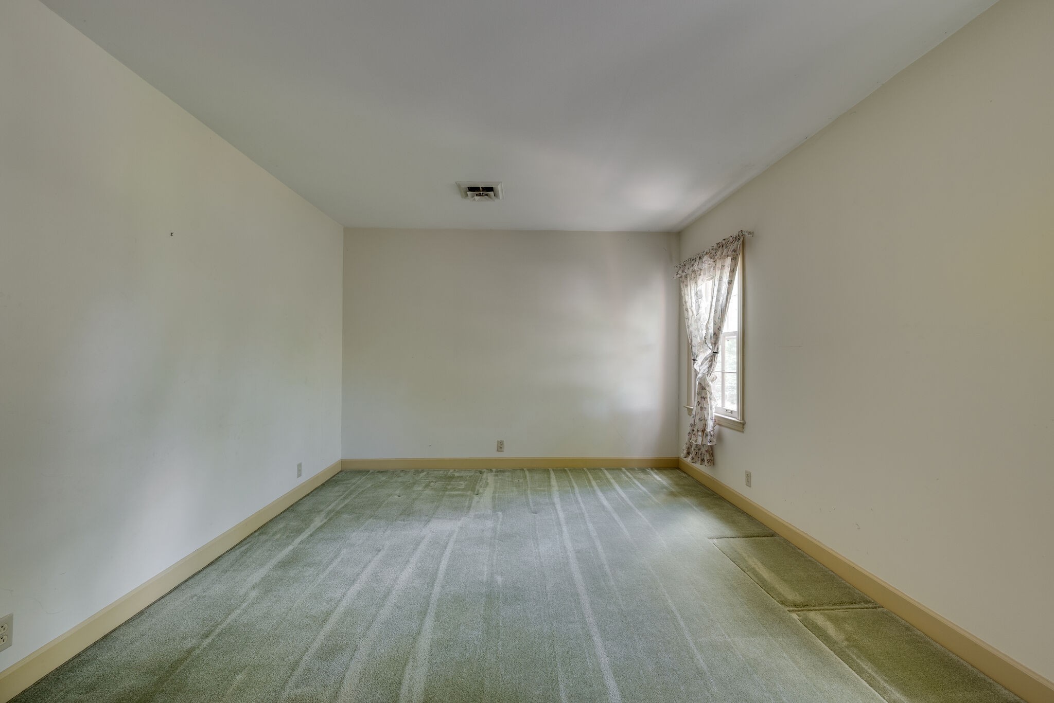 3704 Estes Road, Unit E Nashville, TN 37215 - Photo 20 of 27 an empty room with wooden floor and windows
