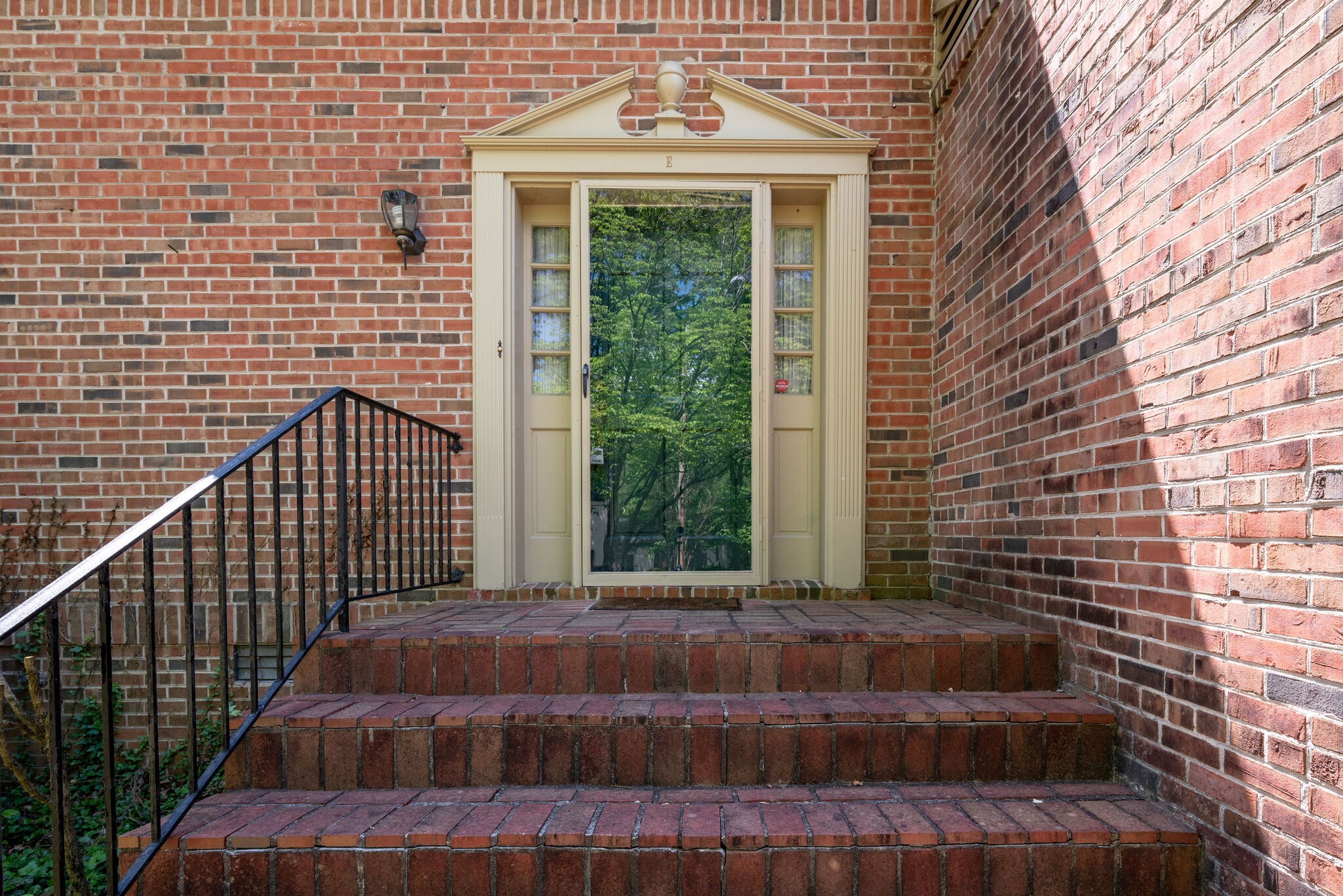 3704 Estes Road, Unit E Nashville, TN 37215 - Photo 3 of 27 a view of a brick house with a floor to ceiling window