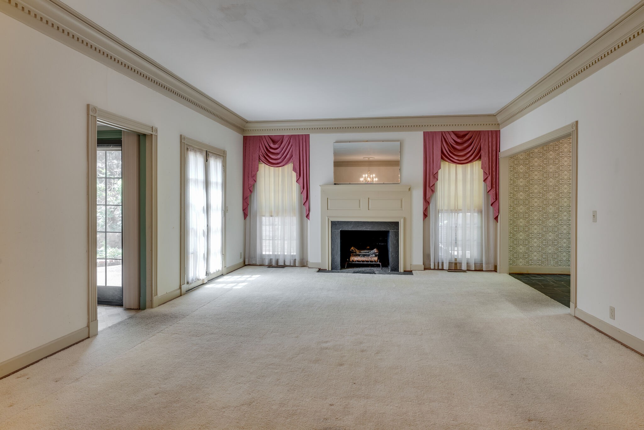 3704 Estes Road, Unit E Nashville, TN 37215 - Photo 7 of 27 a view of an empty room with a fireplace and a window