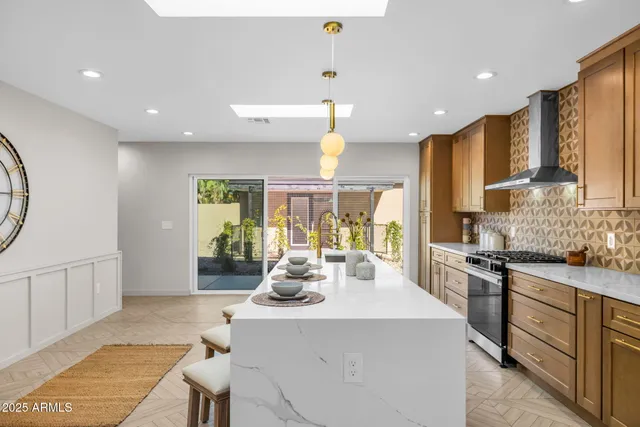 a kitchen with a stove a clock and a table