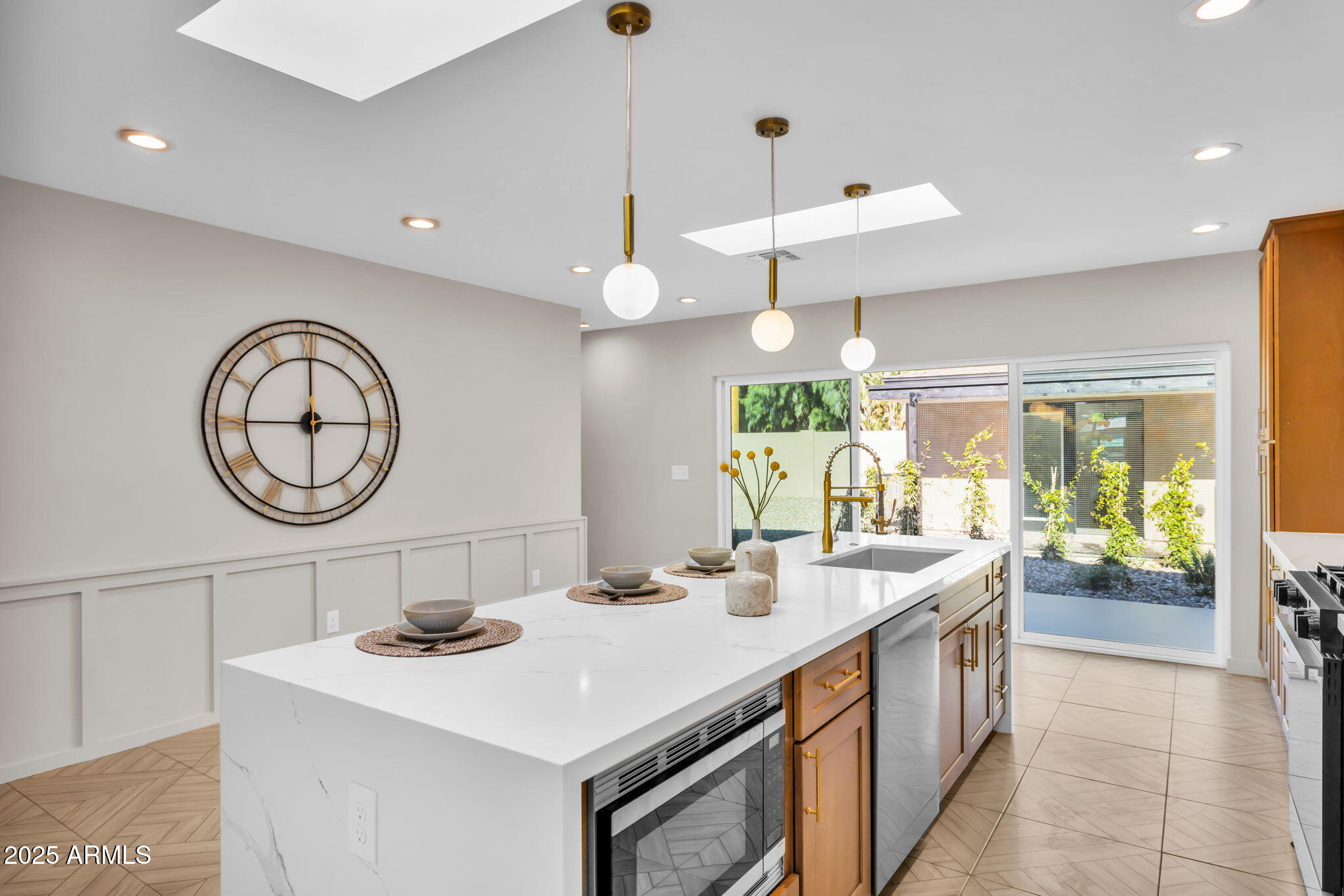 1540 East Cheery Lynn Road Phoenix, AZ 85014 - Photo 12 of 46 a bathroom with a sink a large mirror and a clock on the table