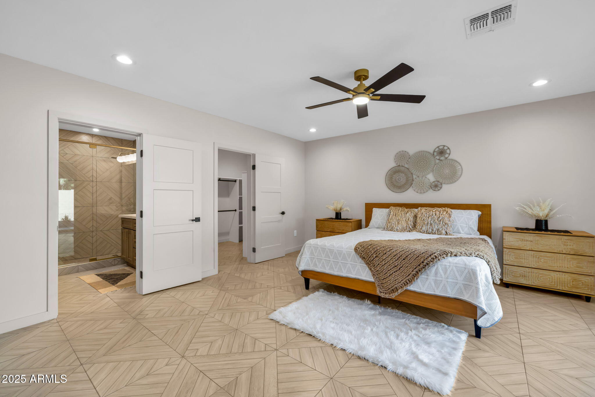 1540 East Cheery Lynn Road Phoenix, AZ 85014 - Photo 16 of 46 a spacious bedroom with a bed and a walk in closet