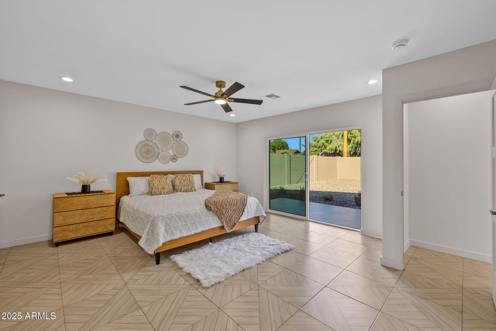1540 East Cheery Lynn Road Phoenix, AZ 85014 - Photo 17 of 46 a bedroom with a bed and a table in it