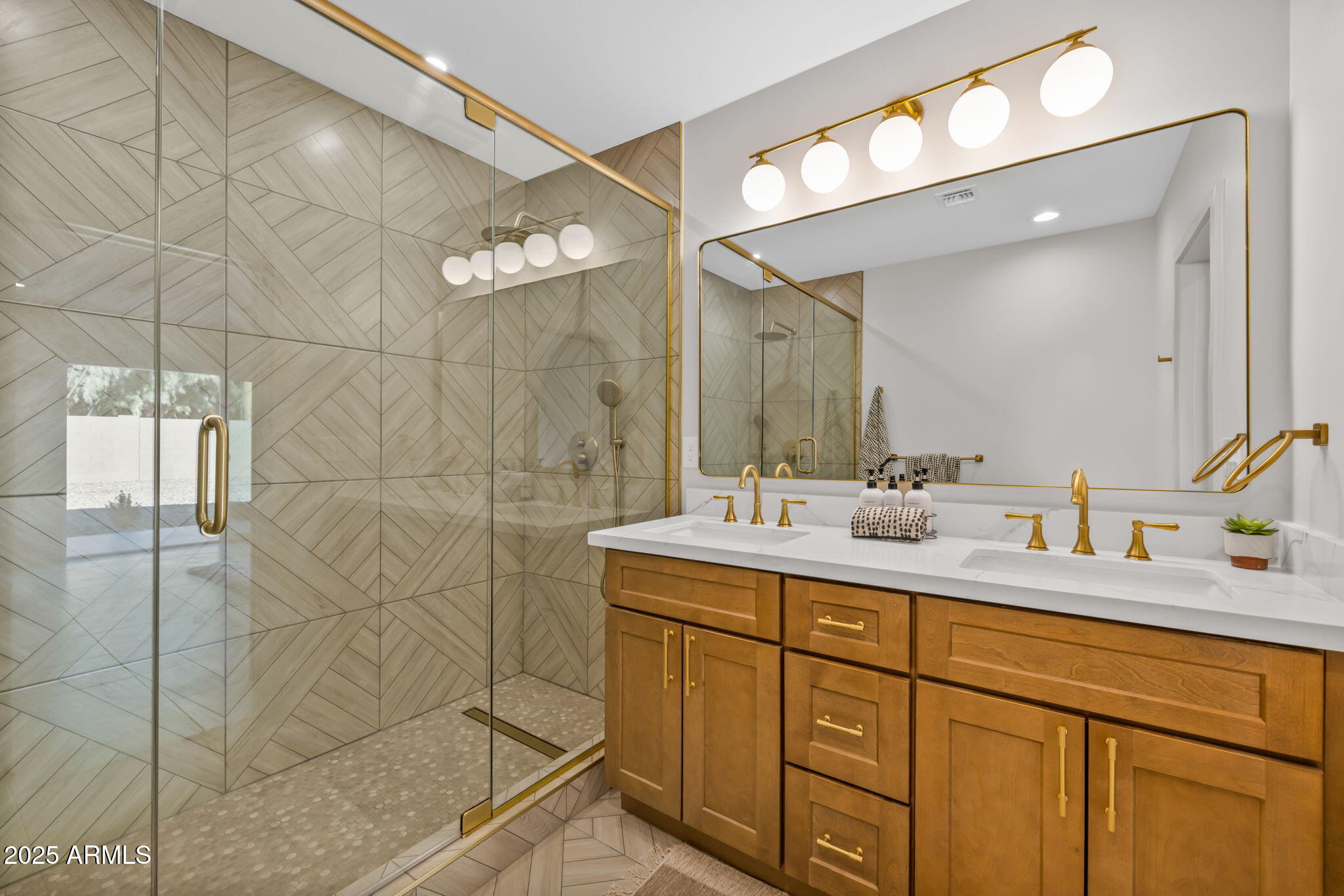 1540 East Cheery Lynn Road Phoenix, AZ 85014 - Photo 18 of 46 a bathroom with a double vanity sink and mirror