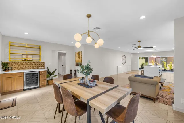 a view of a dining room with furniture and window