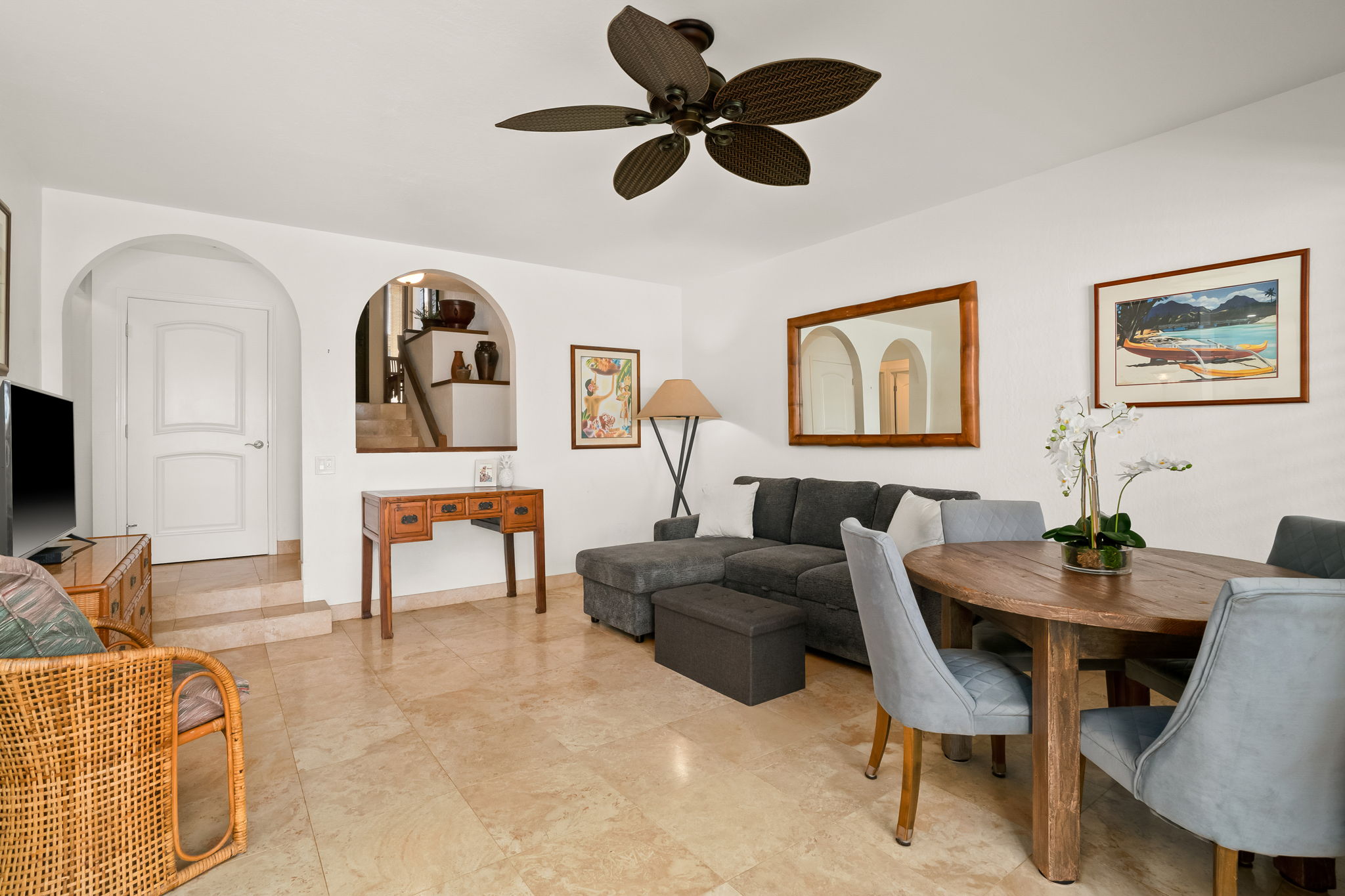 1901 Poipu Road, Unit 212 Koloa, HI 96756 - Photo 14 of 30 a living room with furniture a rug and a large window