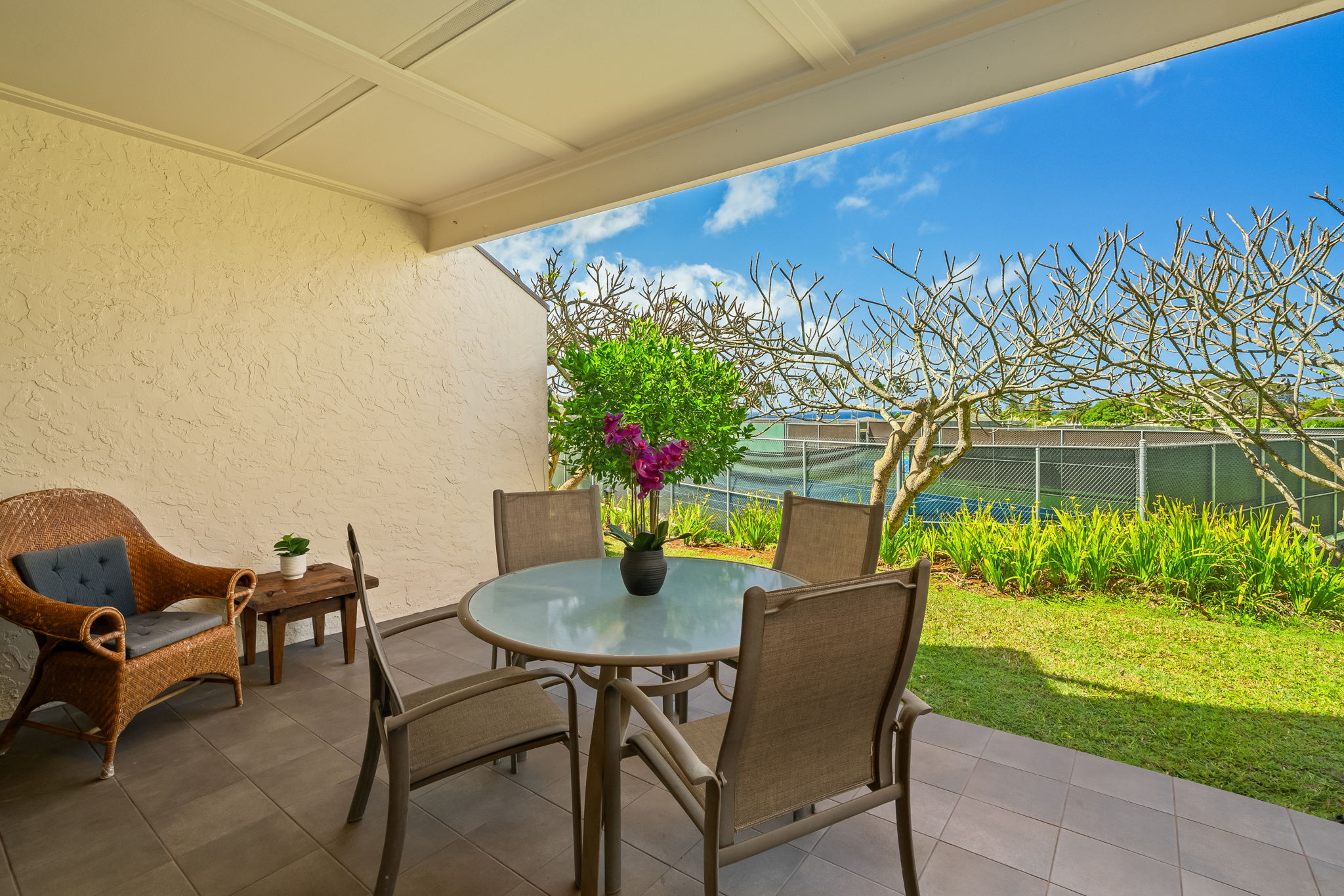 1901 Poipu Road, Unit 212 Koloa, HI 96756 - Photo 17 of 30 a view of a patio with a table and chairs