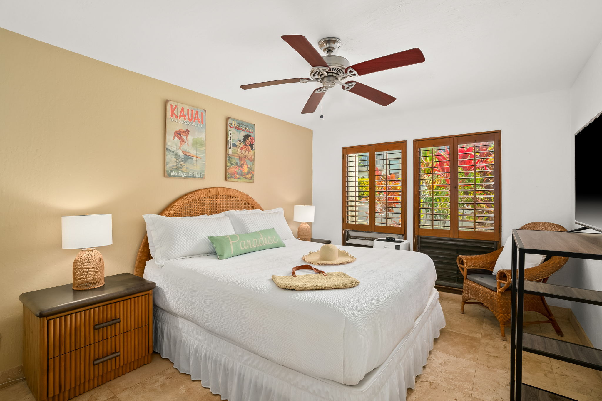 1901 Poipu Road, Unit 212 Koloa, HI 96756 - Photo 20 of 30 a bedroom with a bed and wooden floor