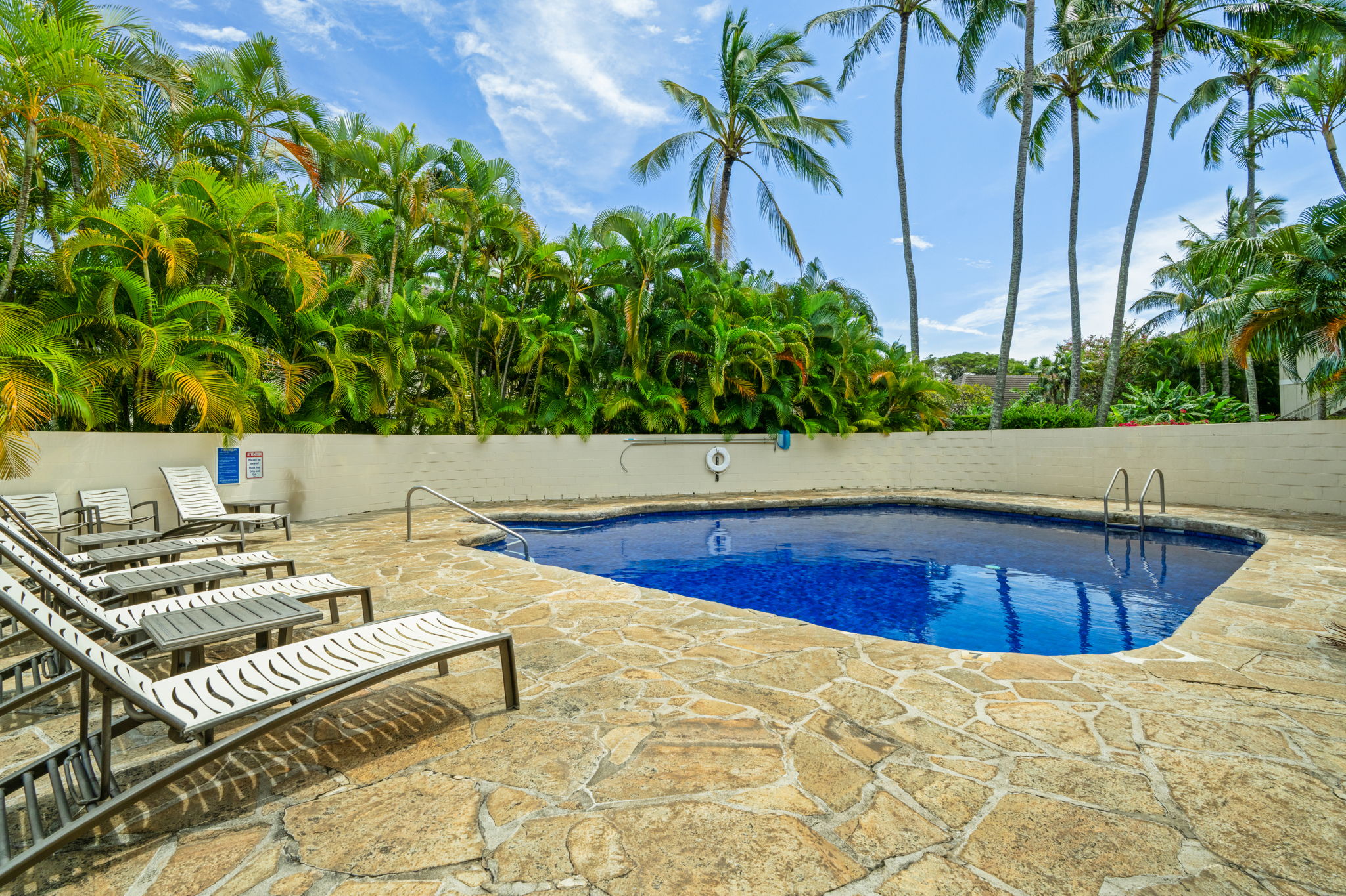 1901 Poipu Road, Unit 212 Koloa, HI 96756 - Photo 25 of 30 a view of swimming pool with chairs