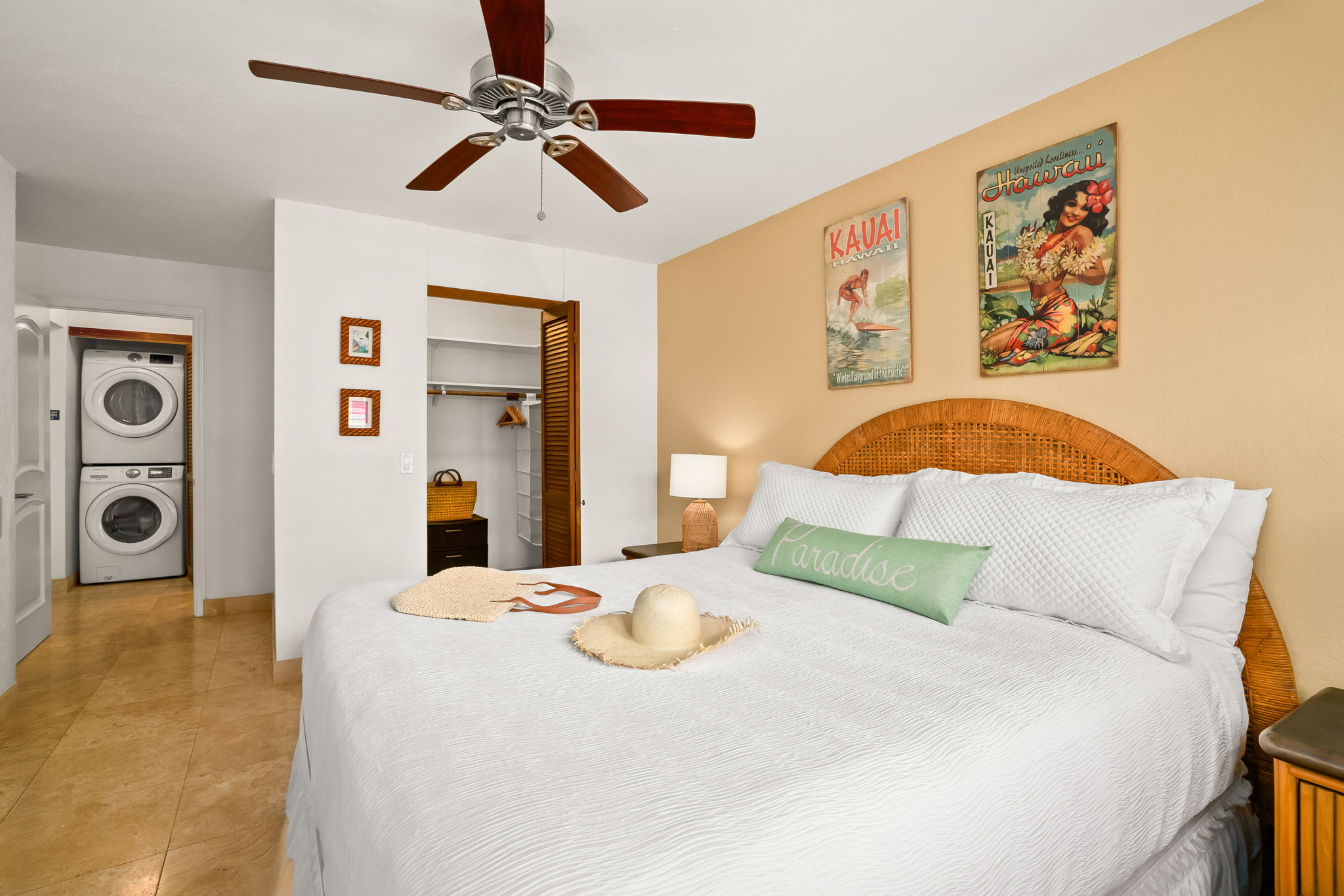 1901 Poipu Road, Unit 212 Koloa, HI 96756 - Photo 5 of 8 a bedroom with a bed and a painting on the wall