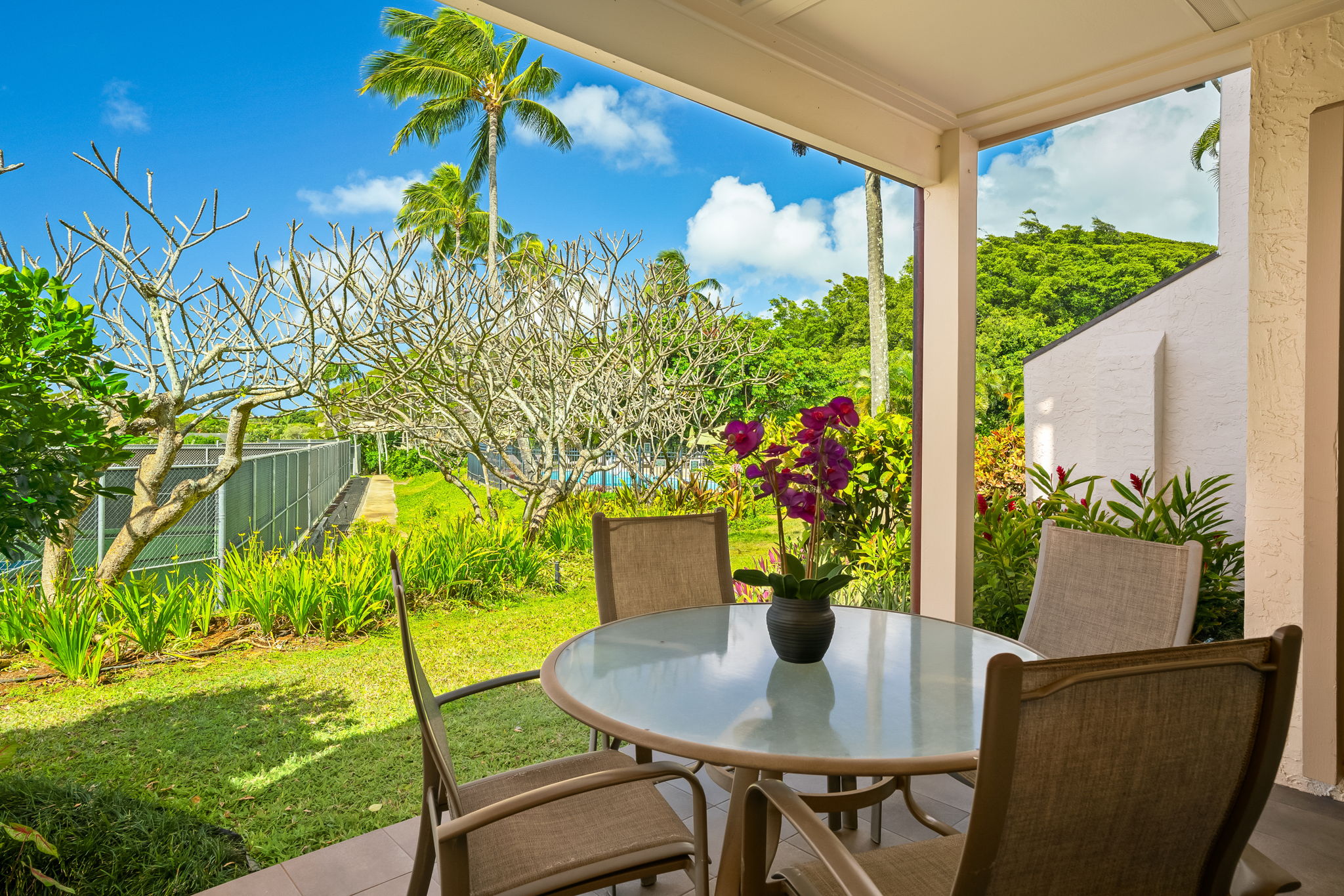 1901 Poipu Road, Unit 212 Koloa, HI 96756 - Photo 8 of 8 a view of a dining room with furniture and a garden