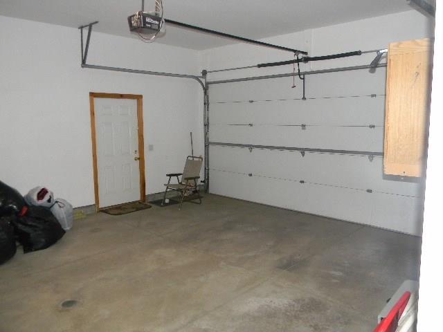 70 Colonial Road Westbrook, ME 04092 - Photo 34 of 35 Large two car garage with door...