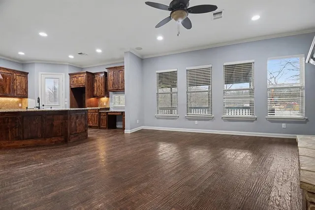 a view of a kitchen with a sink and a window