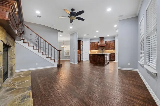 a view of kitchen and hall with wooden floor