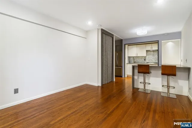 a view of a livingroom with furniture and wooden floor