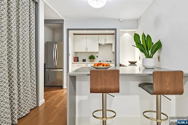 a dining room with furniture and wooden floor