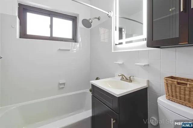 a bathroom with a sink and a bathtub