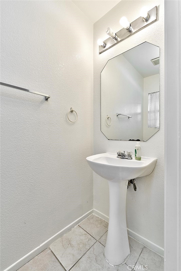 5280 Melbourne Place Riverside, CA 92508 - Photo 15 of 59 a bathroom with a sink and mirror