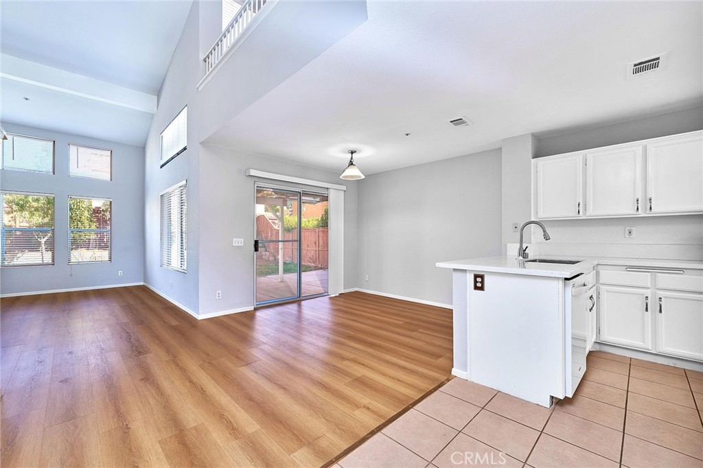 5280 Melbourne Place Riverside, CA 92508 - Photo 17 of 59 a view of a kitchen with wooden floor and a sink