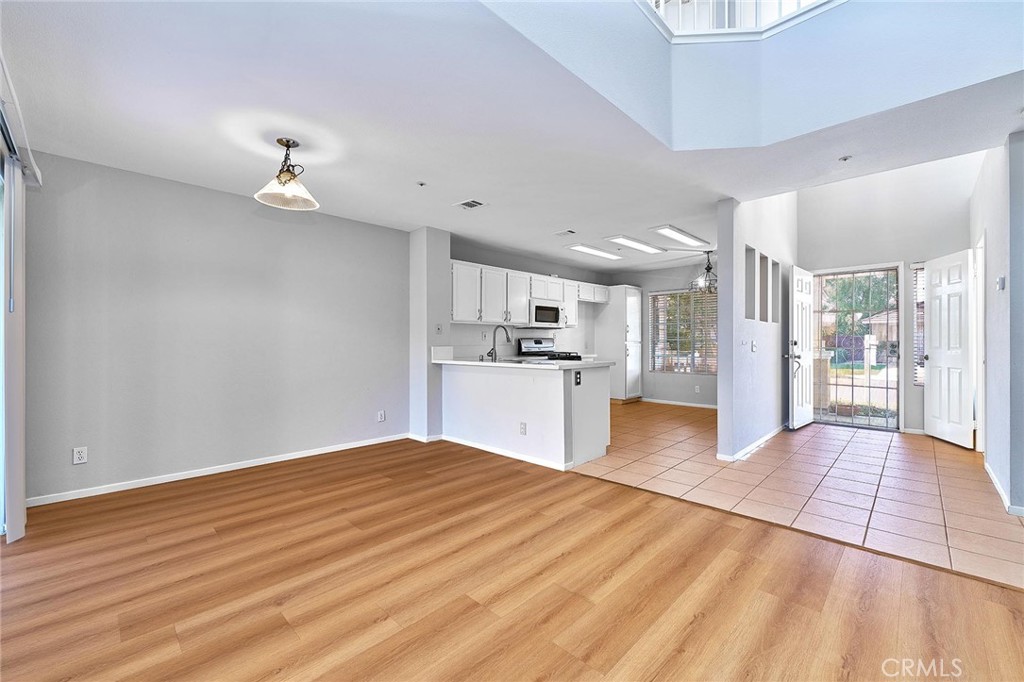 5280 Melbourne Place Riverside, CA 92508 - Photo 18 of 59 a view of a kitchen with refrigerator and wooden floor