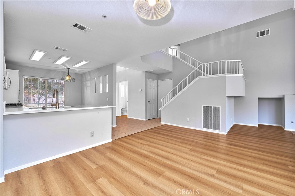 5280 Melbourne Place Riverside, CA 92508 - Photo 20 of 59 a view of a kitchen with wooden floor and a sink