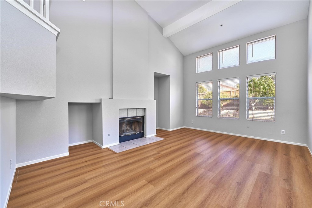 5280 Melbourne Place Riverside, CA 92508 - Photo 26 of 59 a view of empty room with wooden floor and fireplace