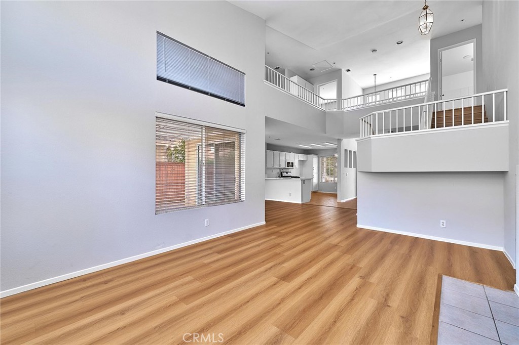 5280 Melbourne Place Riverside, CA 92508 - Photo 28 of 59 a view of an empty room with wooden floor and a window