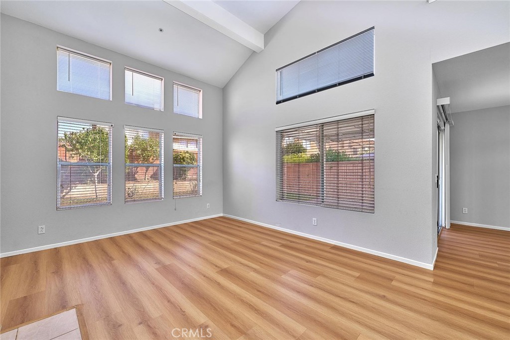5280 Melbourne Place Riverside, CA 92508 - Photo 29 of 59 a view of an empty room with wooden floor and a window