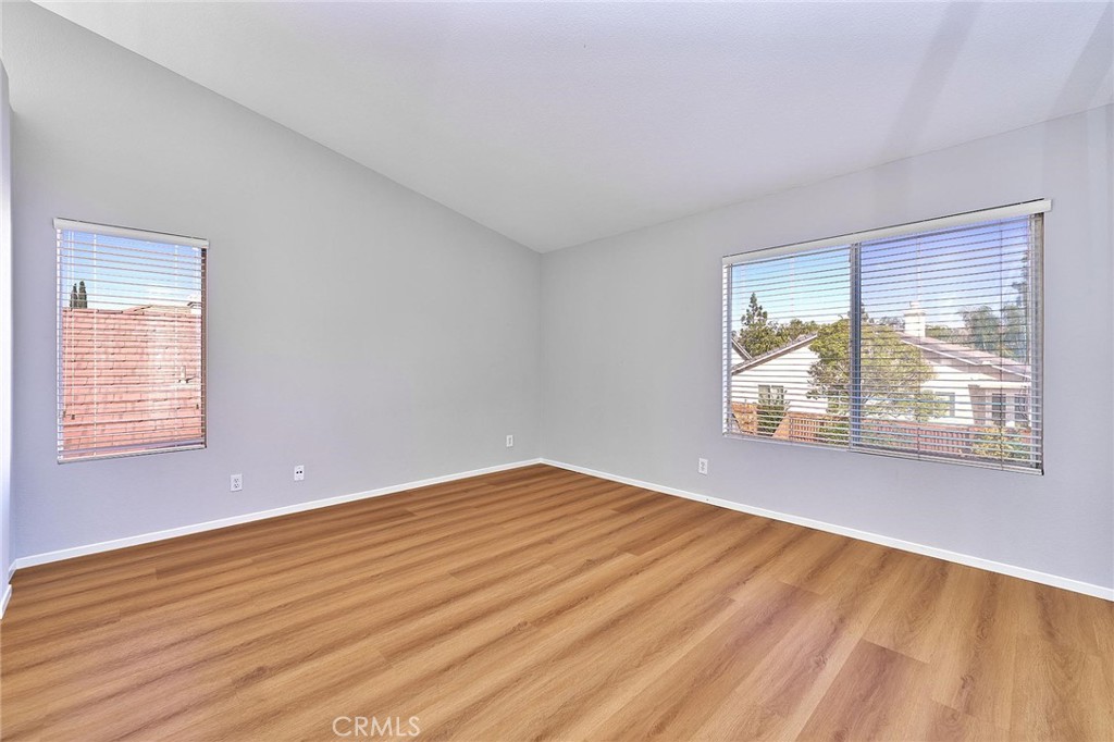 5280 Melbourne Place Riverside, CA 92508 - Photo 34 of 59 a view of an empty room with wooden floor and a window