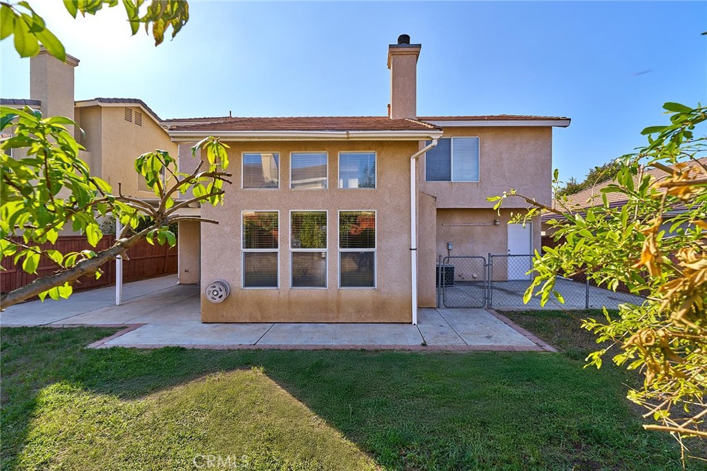 5280 Melbourne Place Riverside, CA 92508 - Photo 48 of 59 a front view of a house with a garden