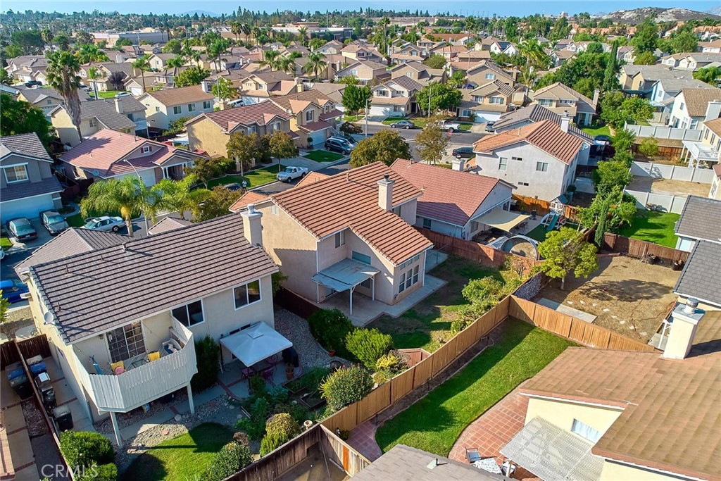 5280 Melbourne Place Riverside, CA 92508 - Photo 5 of 59 an aerial view of a house with a yard and parking space