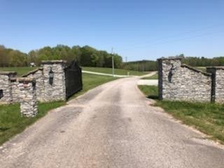 390 Duck Blind Road Clifton, TN 38425 - Photo 11 of 14 a view of a pathway with a wrought fence
